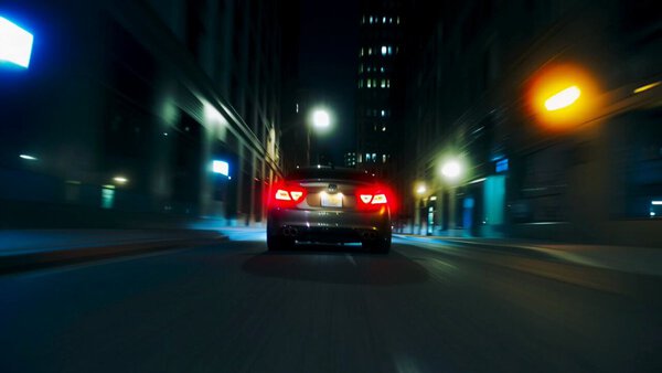 Rear Tracking Shot Sedan City Street Night